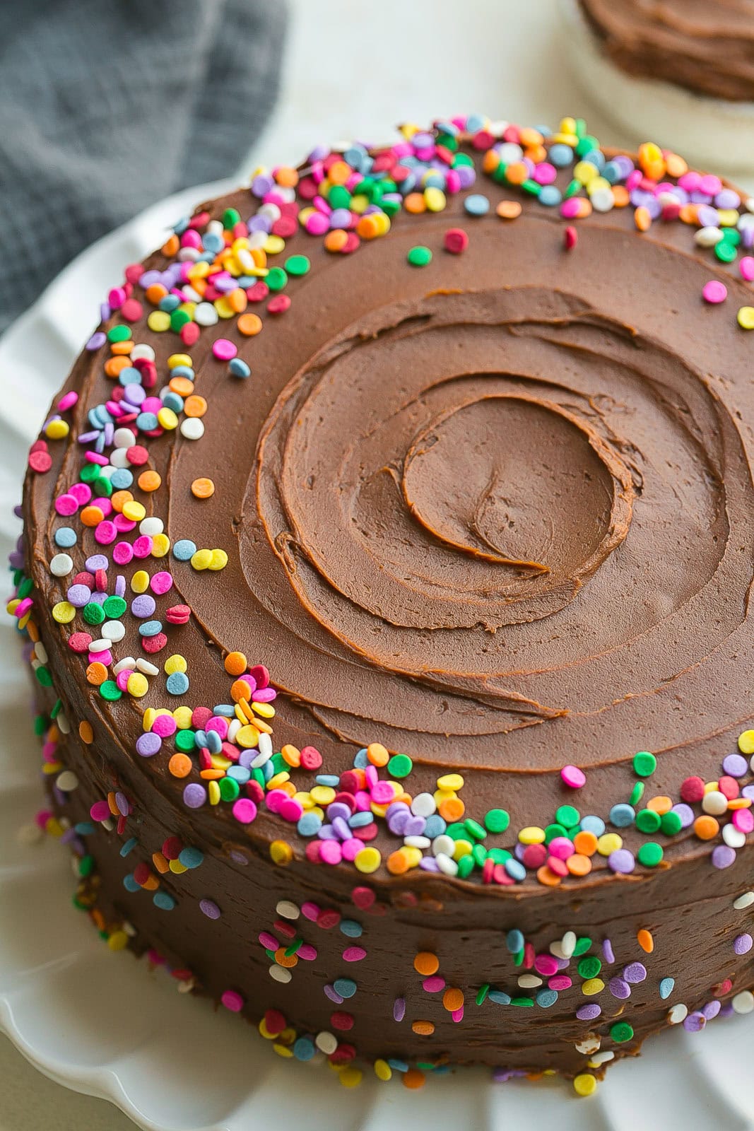 A whole Yellow Cake with sprinkles.