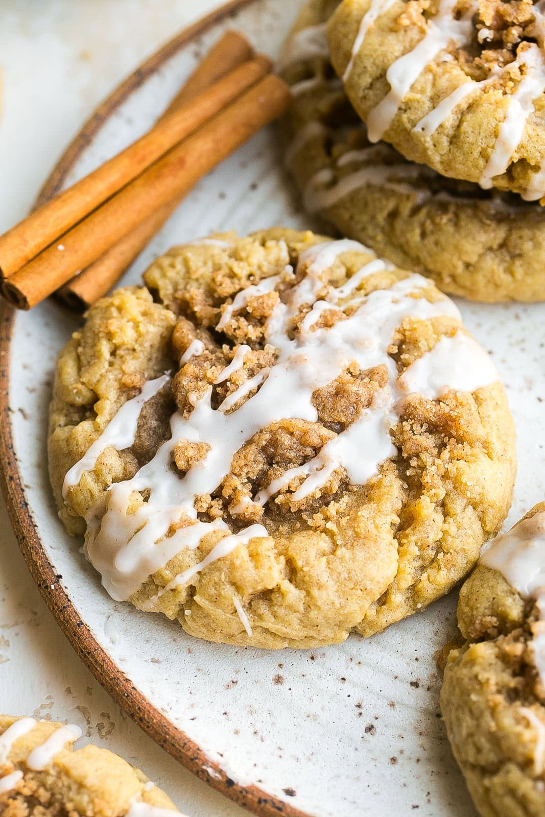 Close up side view of iced Coffee Cake Cookie on a plate.