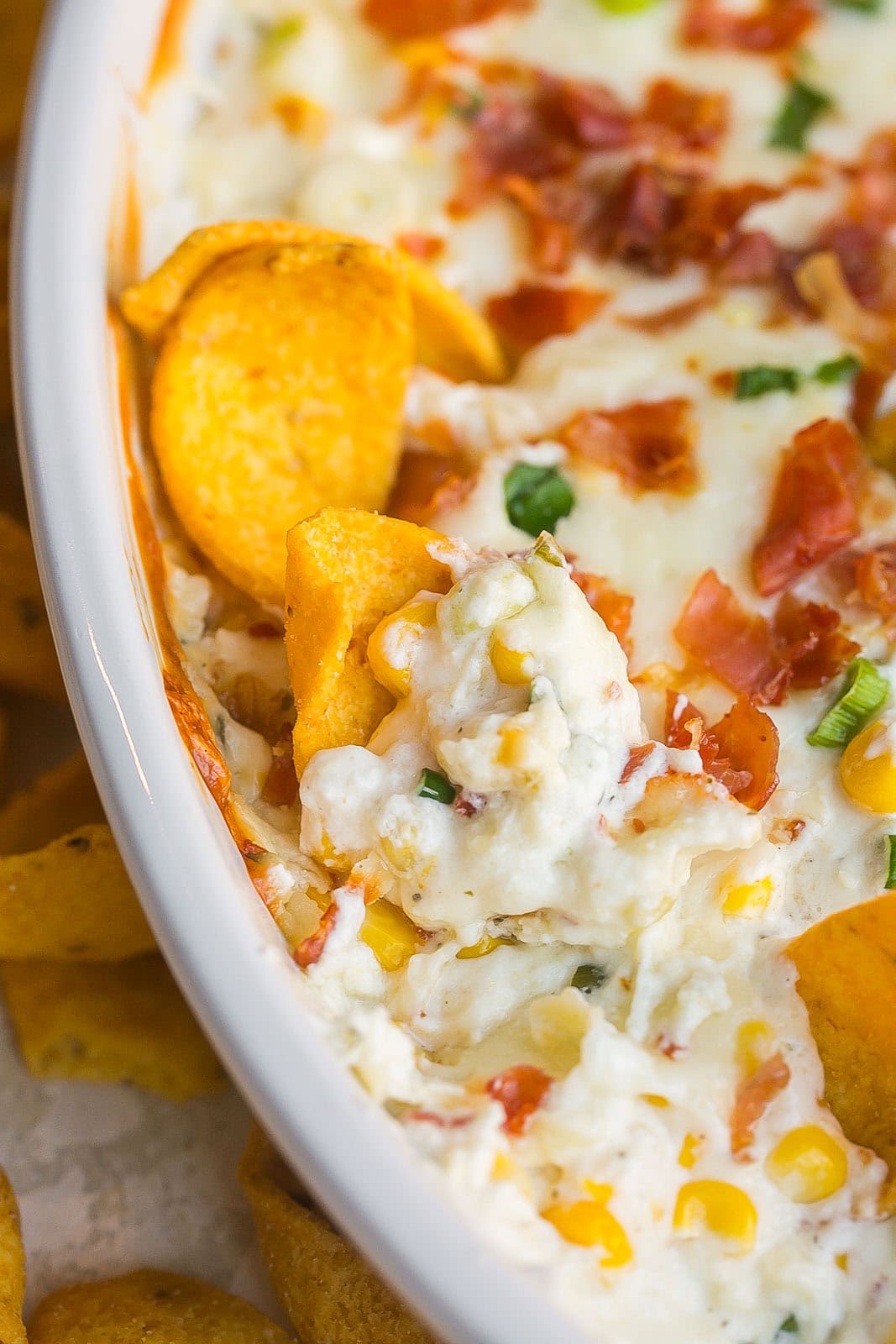 Corn Boursin dip with chip scooped inside.