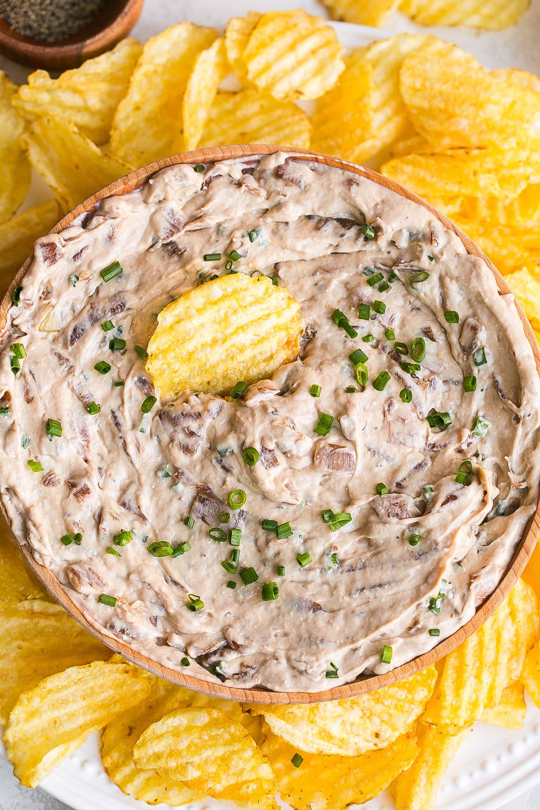 Chip dip in a wooden bowl.