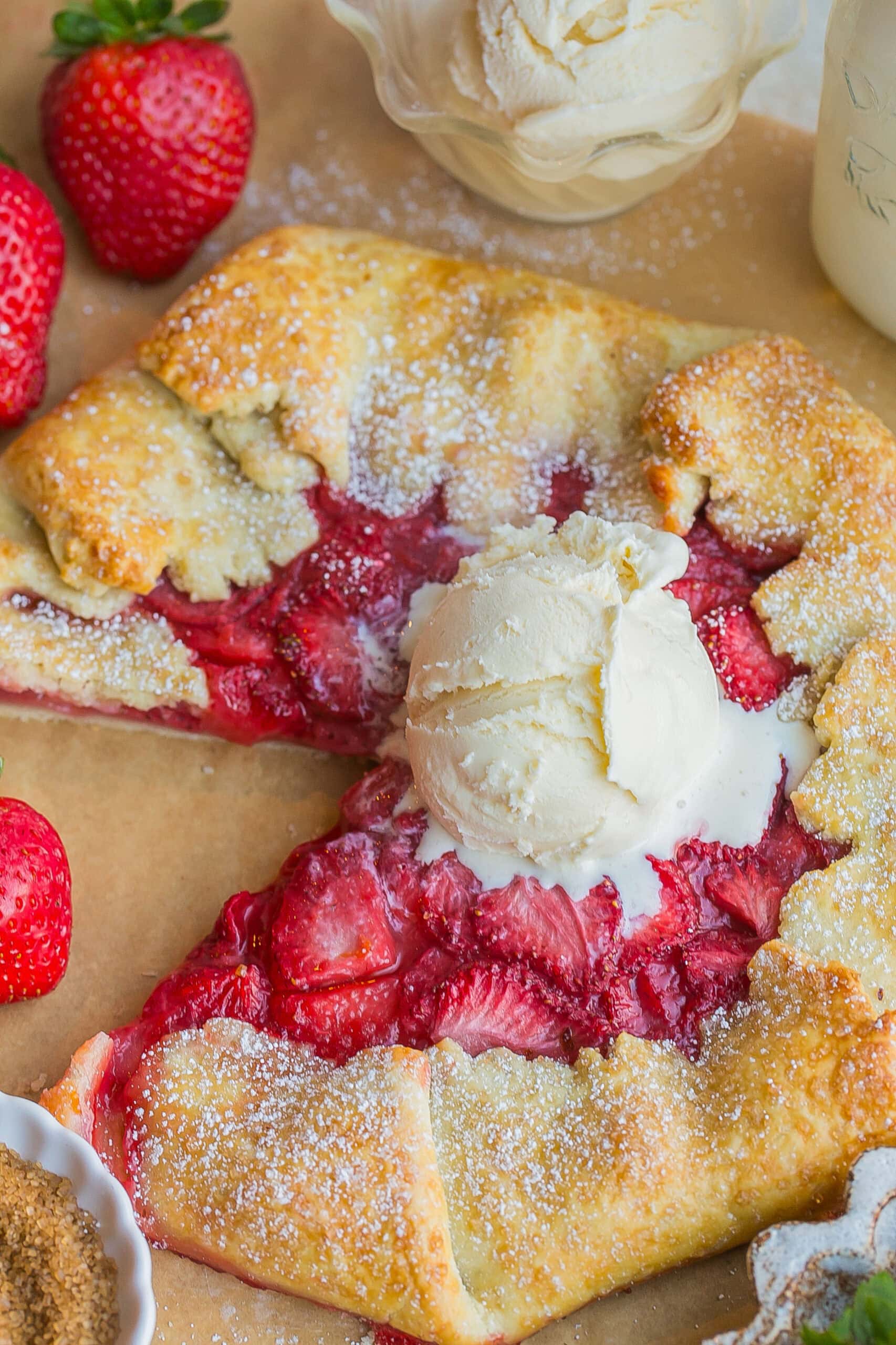 Ice cream on top of strawberry tart galette.