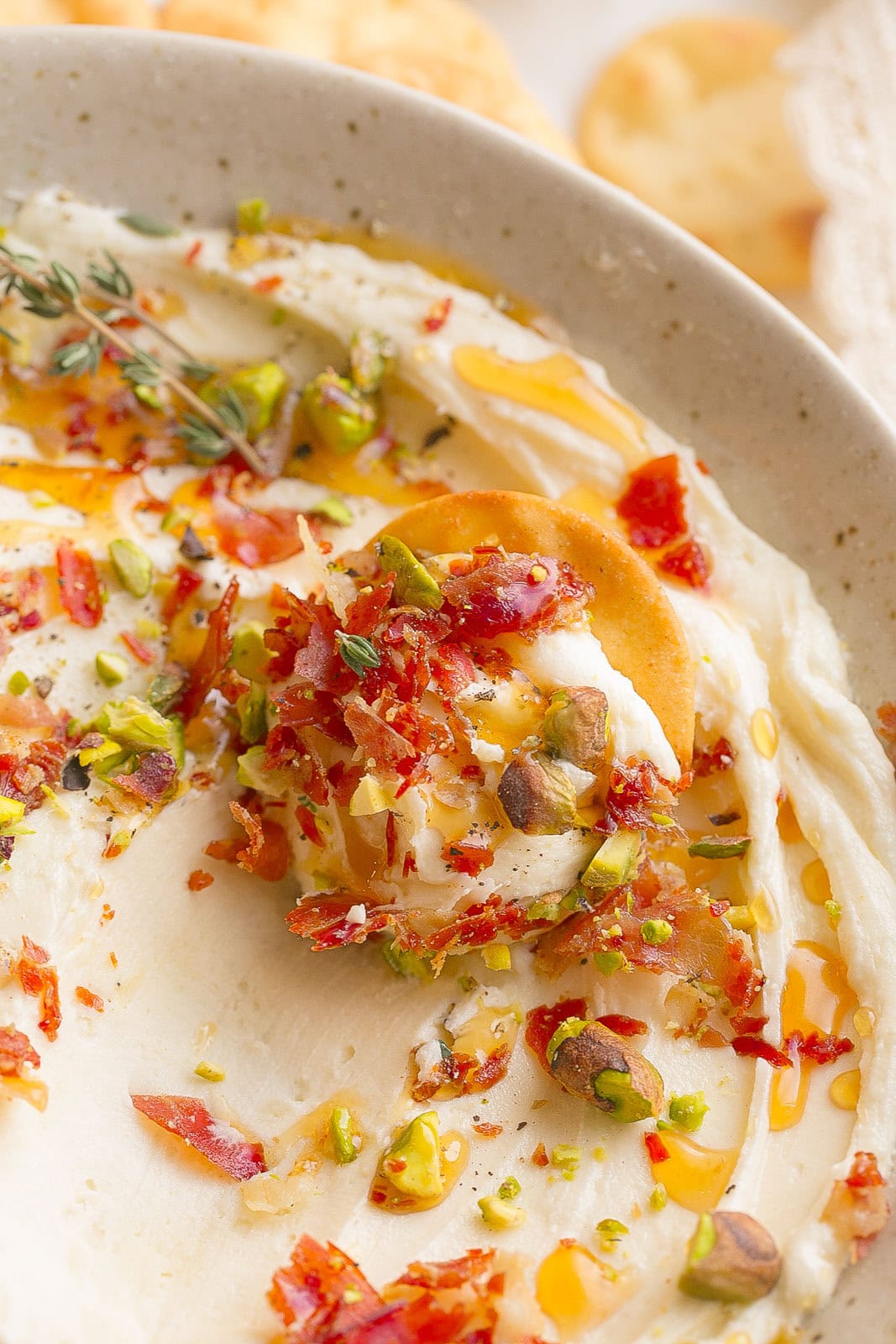 The best brie dip recipe. Cracker scooping the dip perfectly.