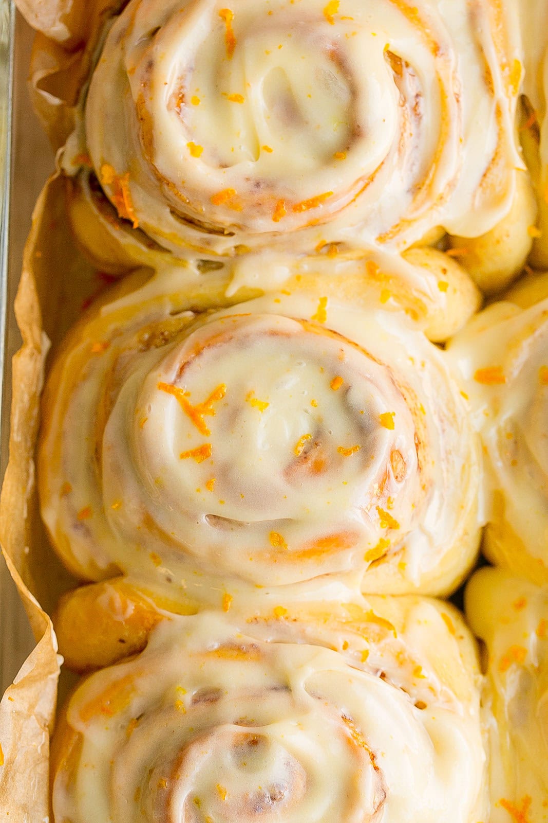 Close up of Glazed Orange Cinnamon Rolls.