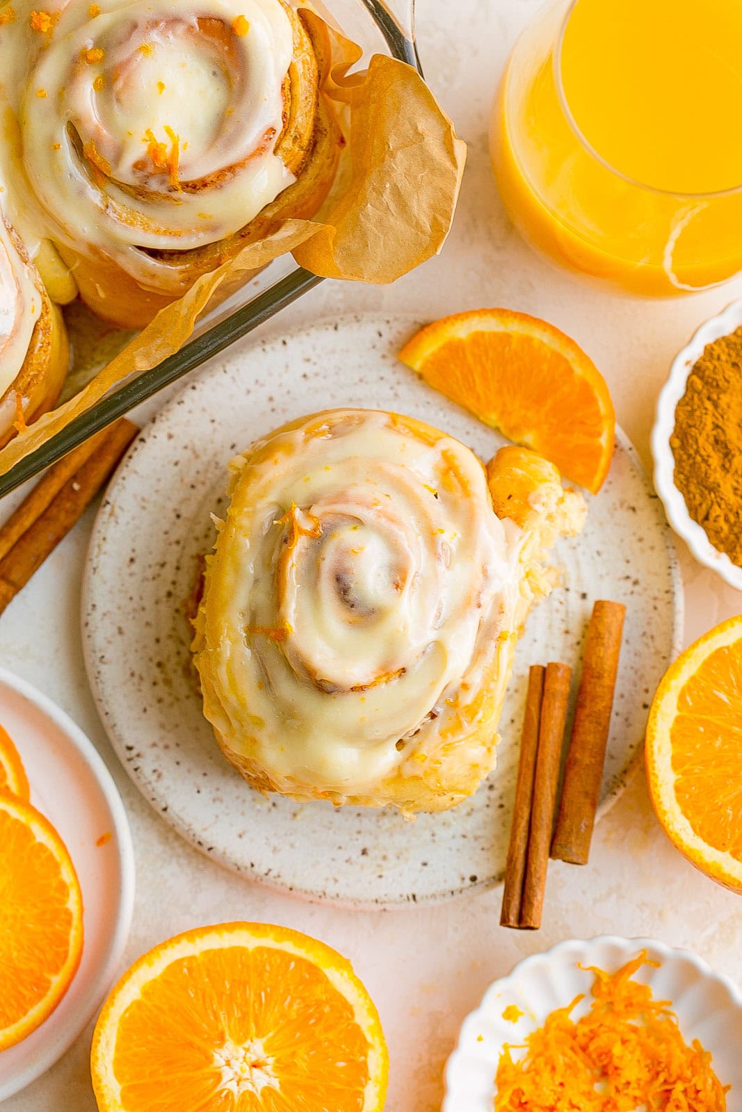 Orange Juice Cinnamon Rolls on a plate.