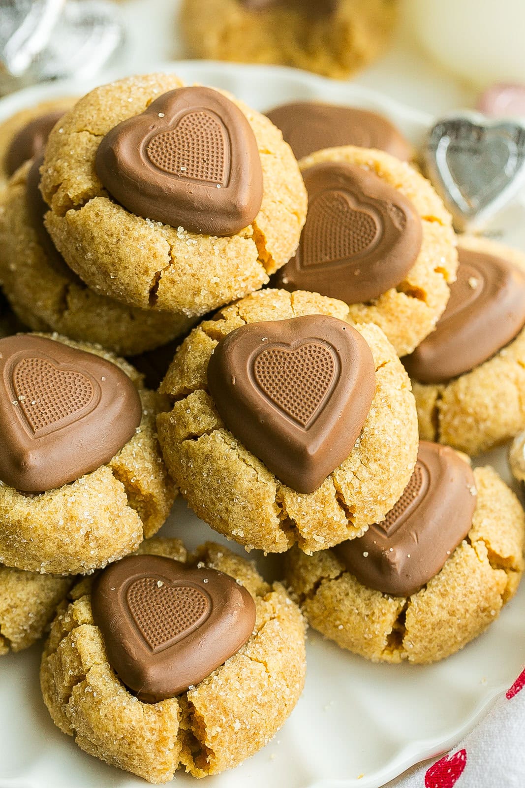 Peanut Butter Cookies with chocolate hearts side view on a plate.