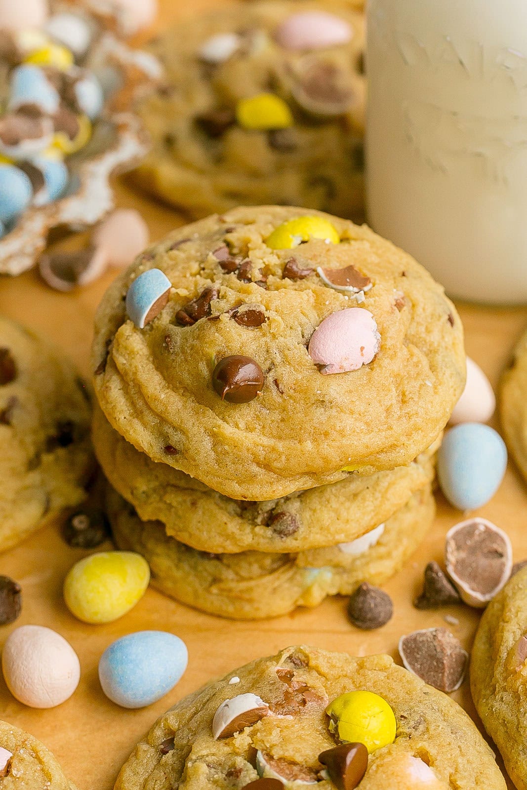 A stack of chocolate chip cookies with mini eggs.