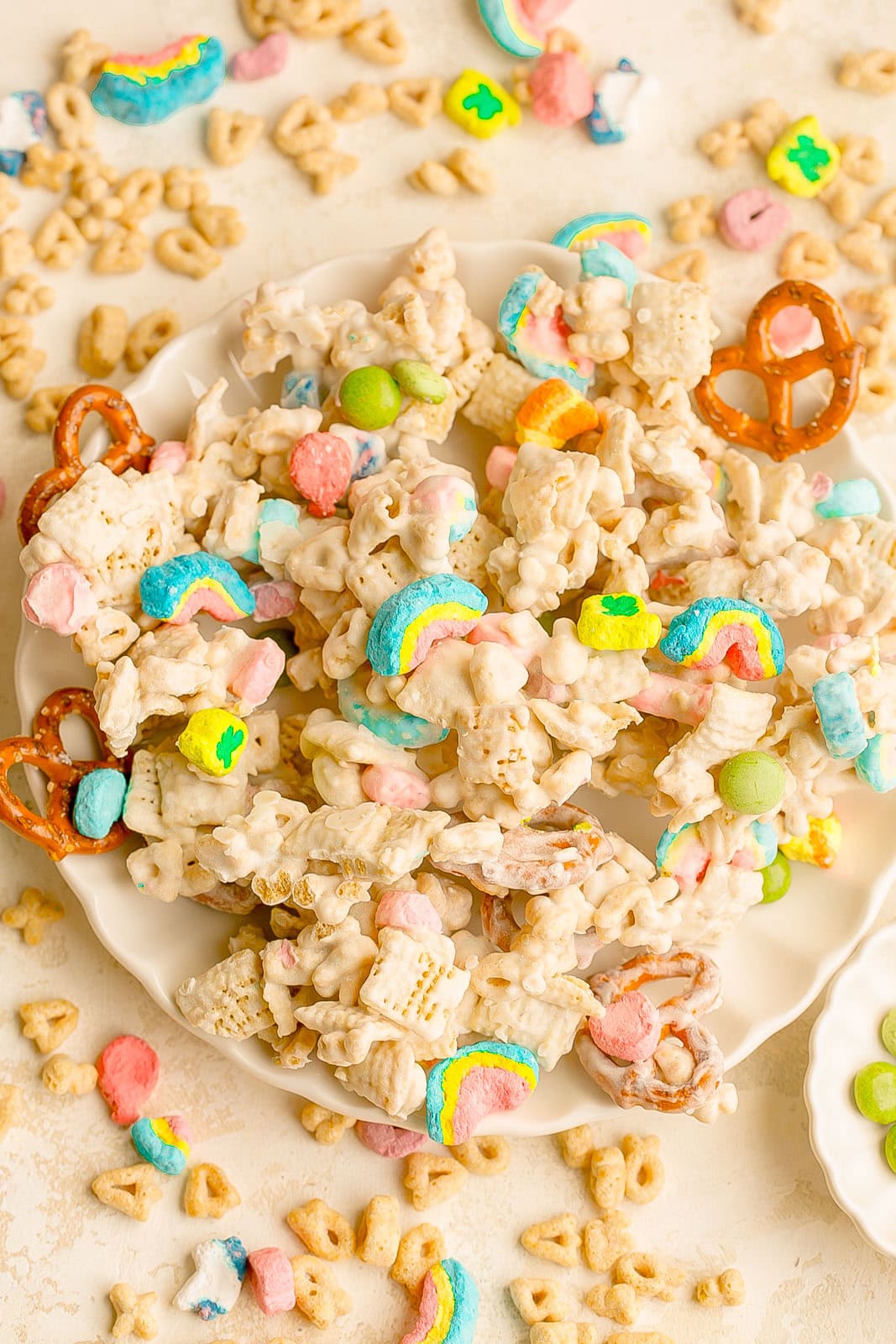 A bowl with Lucky Charms no-bake snack mix overflowing.