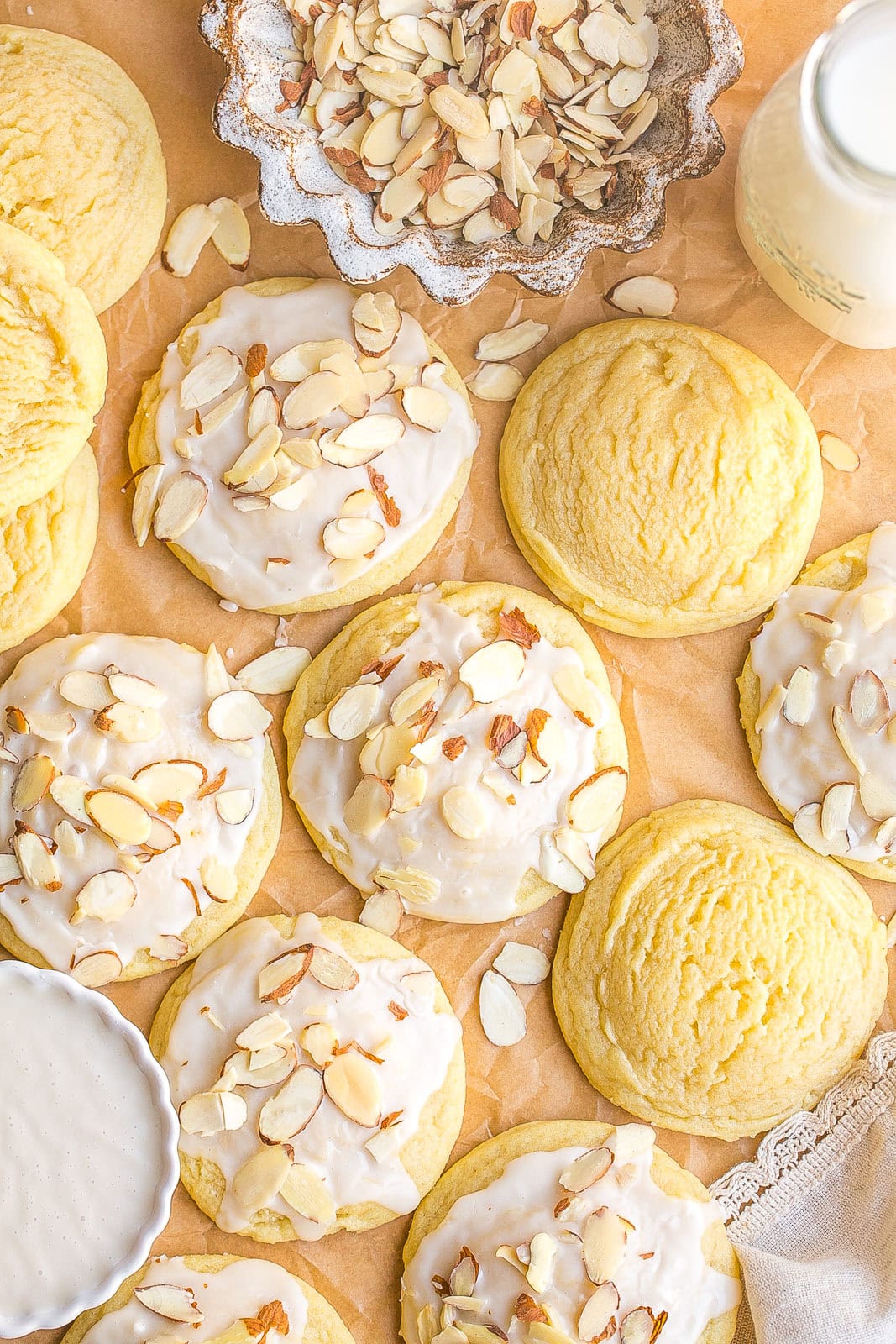 Soft almond sugar cookies on parchment paper.
