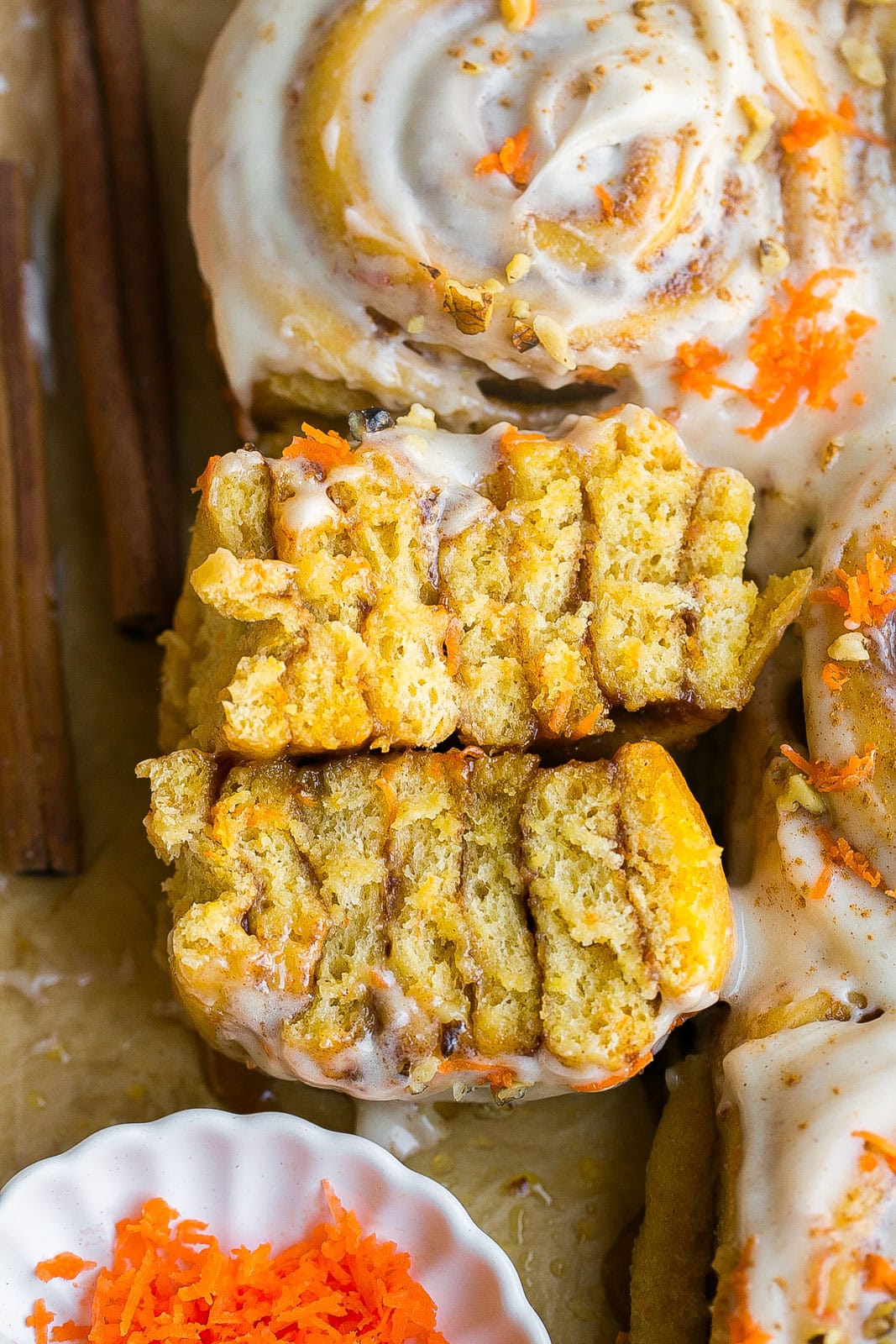 Carrot Cake Cinnamon Roll cut in half.
