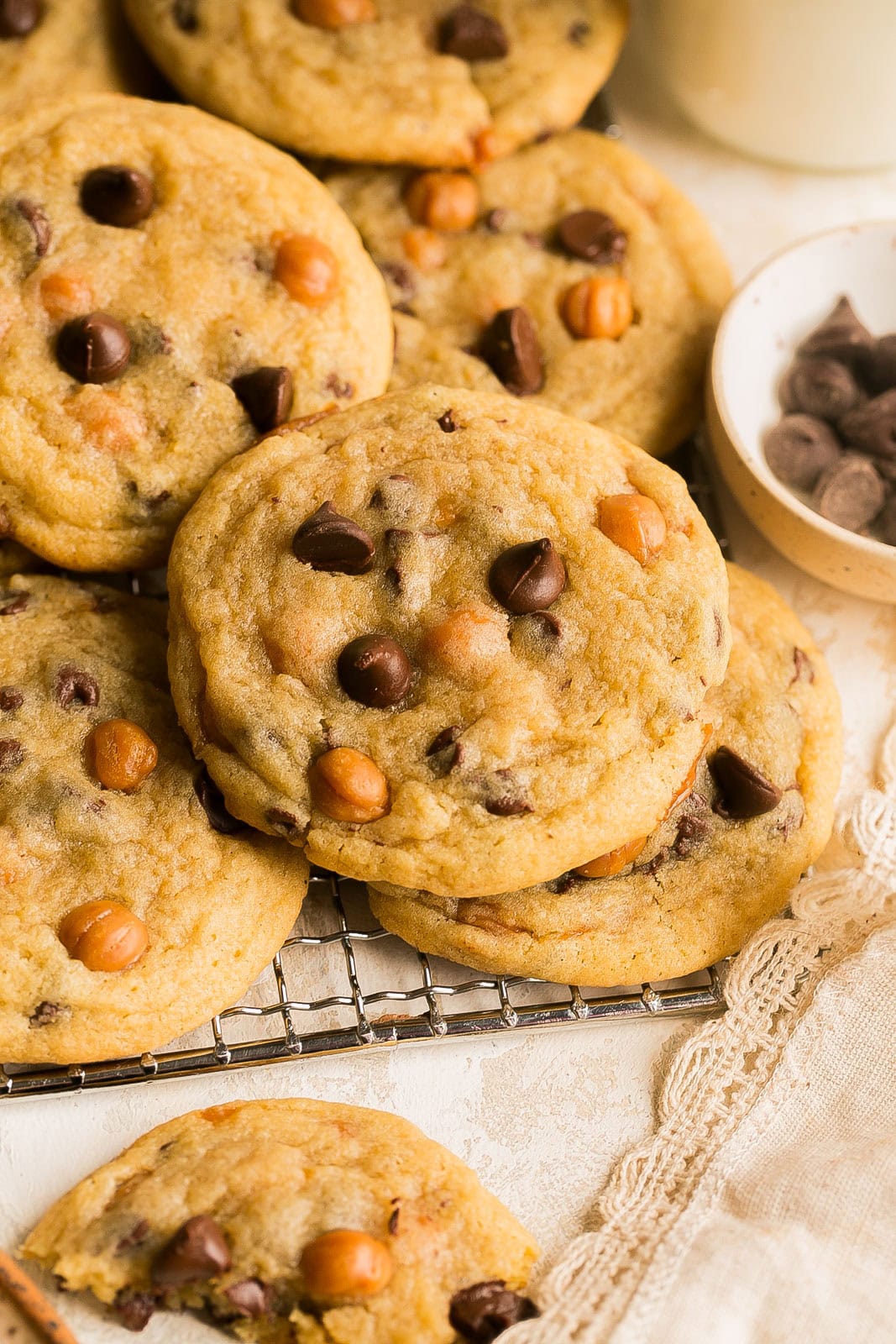 Gooey caramel cookies on a cooling rack.