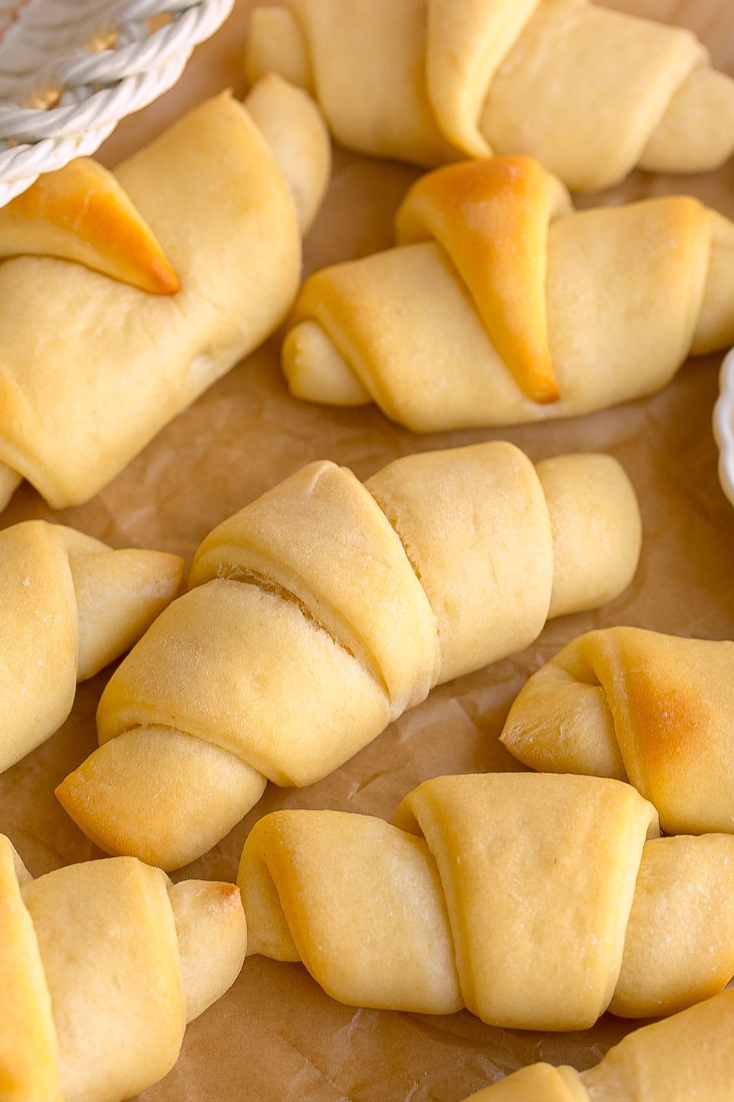 Side view of homemade buttery dinner rolls.