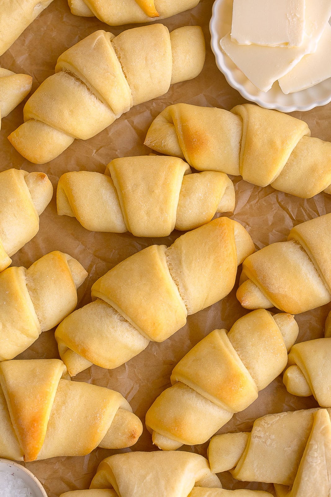 Homemade Crescent Rolls on parchment paper.