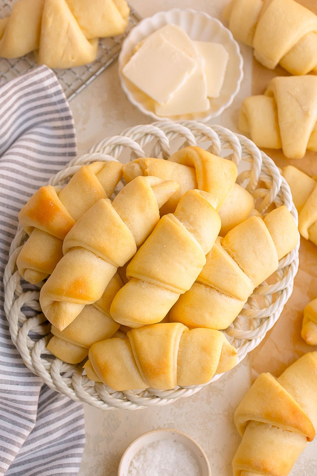 Fresh crescent rolls in a bread basket.
