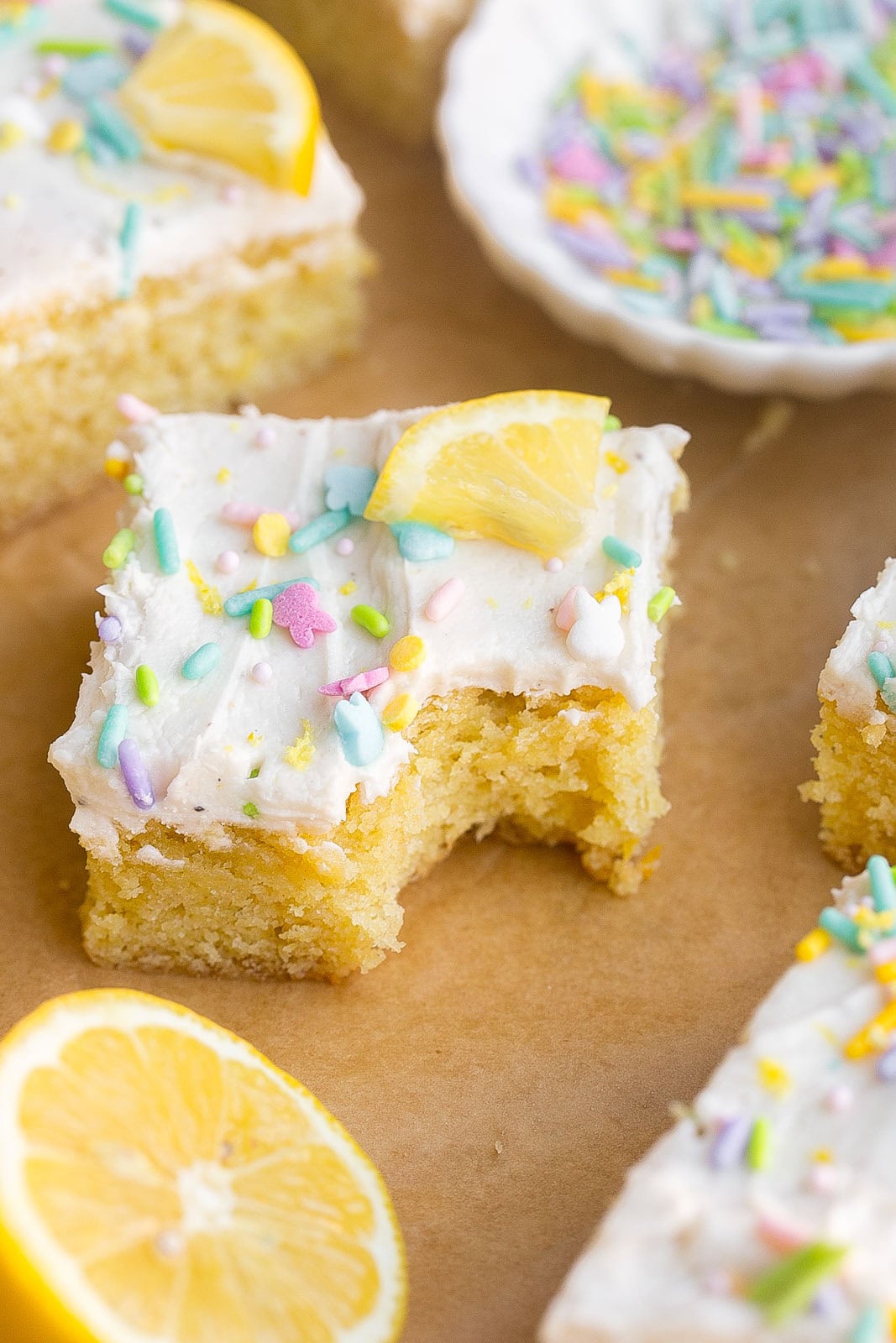 Frosted Lemon Bar with bite mark.