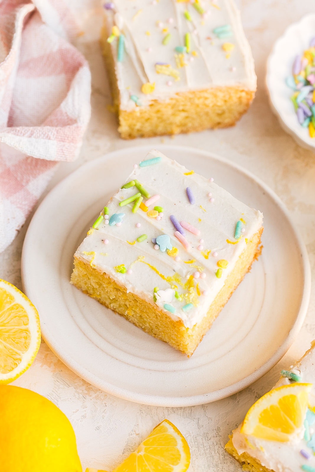 Lemon cookie bars recipe on a small white plate.
