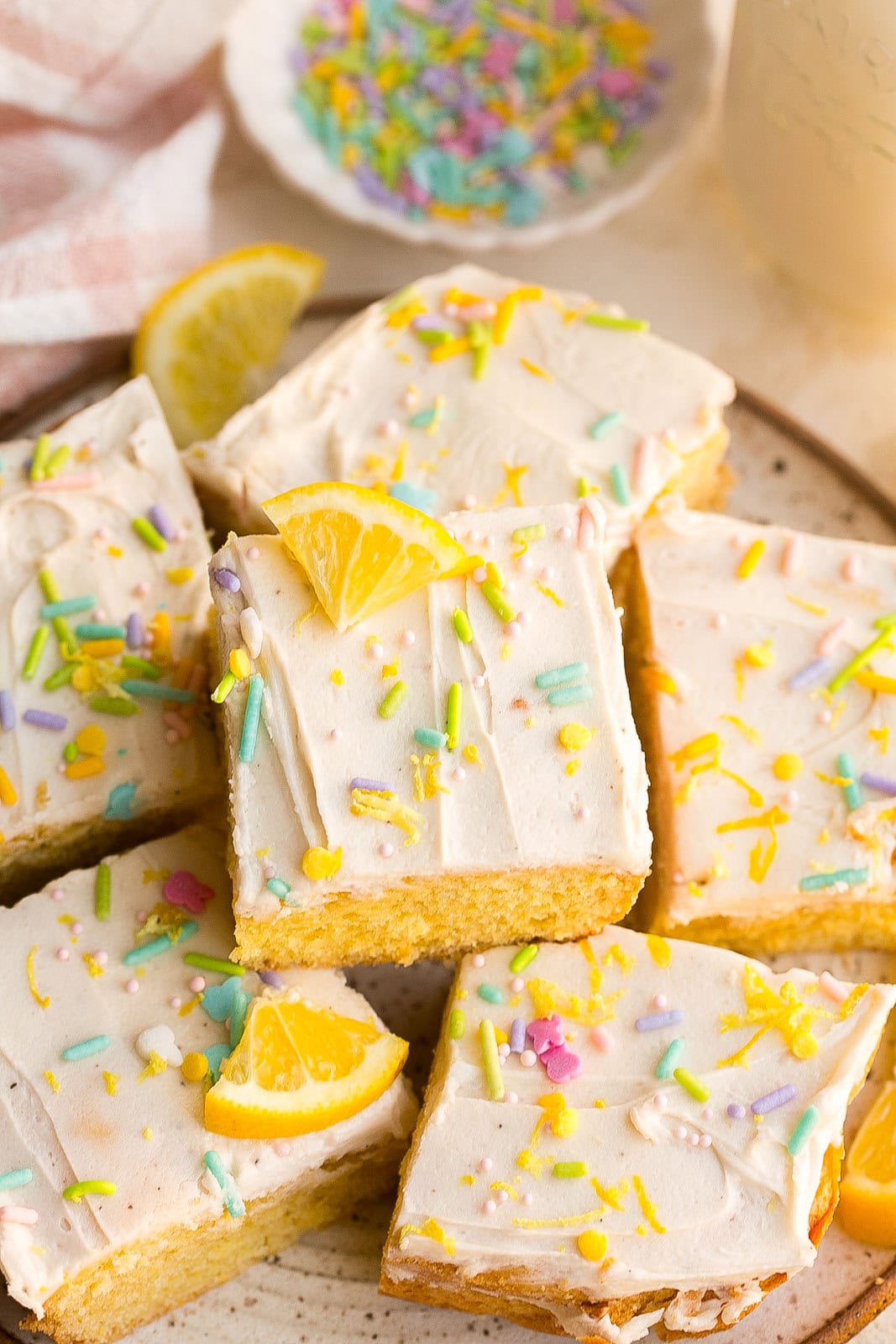 Lemon Sugar Cookie Bars with sprinkles on a plate.