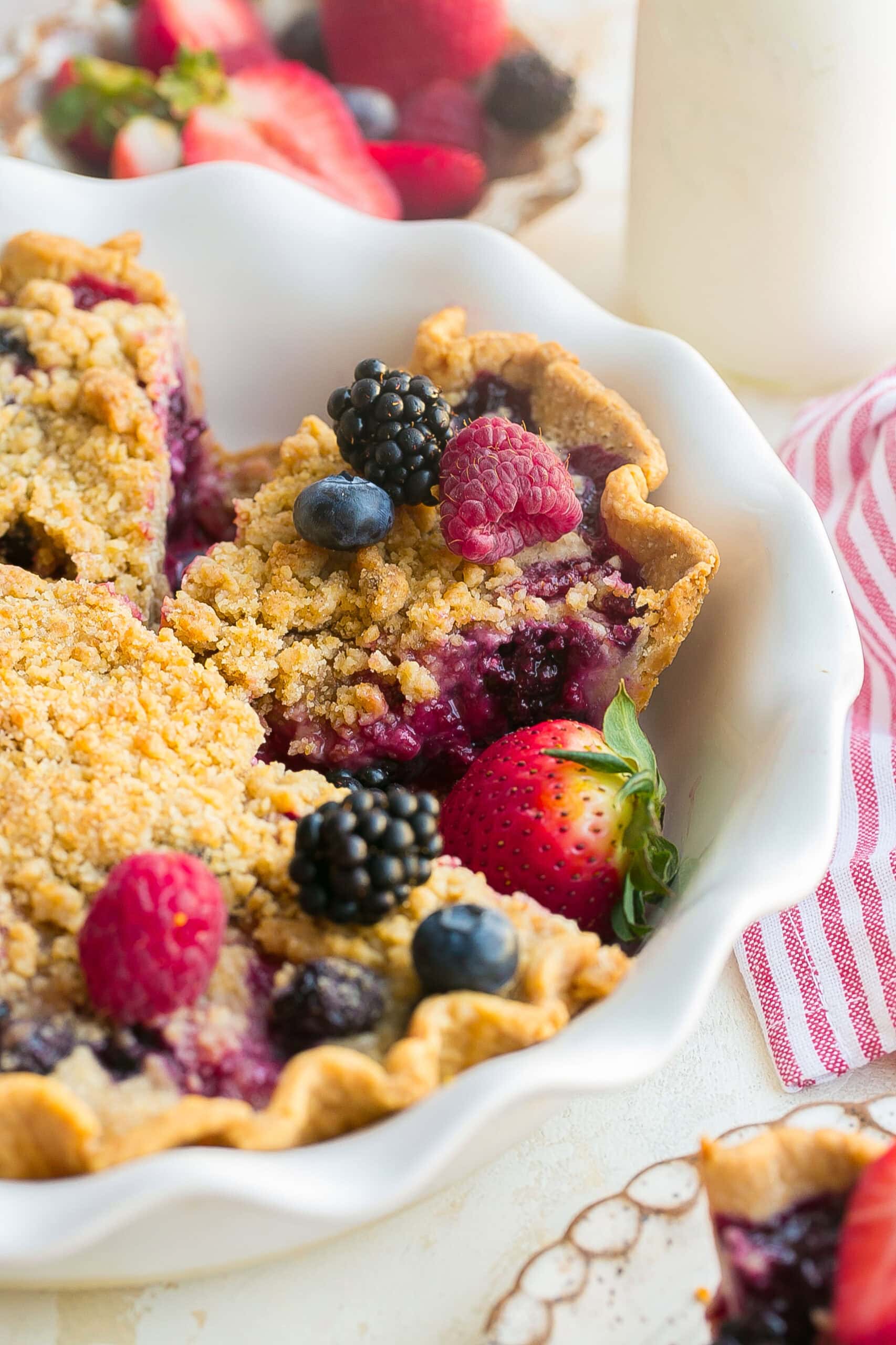 Berry Crumble Pie with golden buttery crumble topping and mixed berry filling.