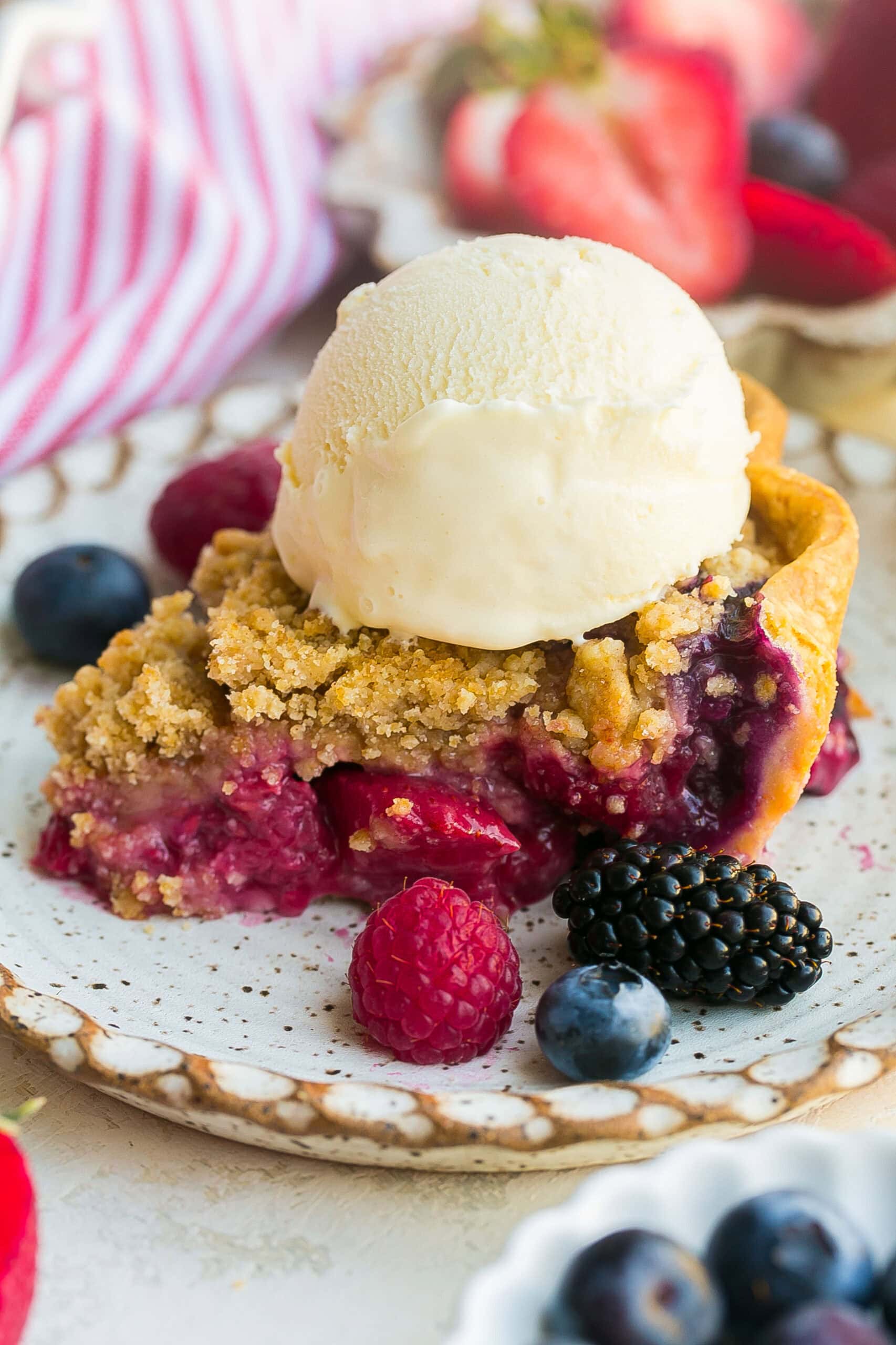 Close up of juicy mixed berry crumble pie filling.