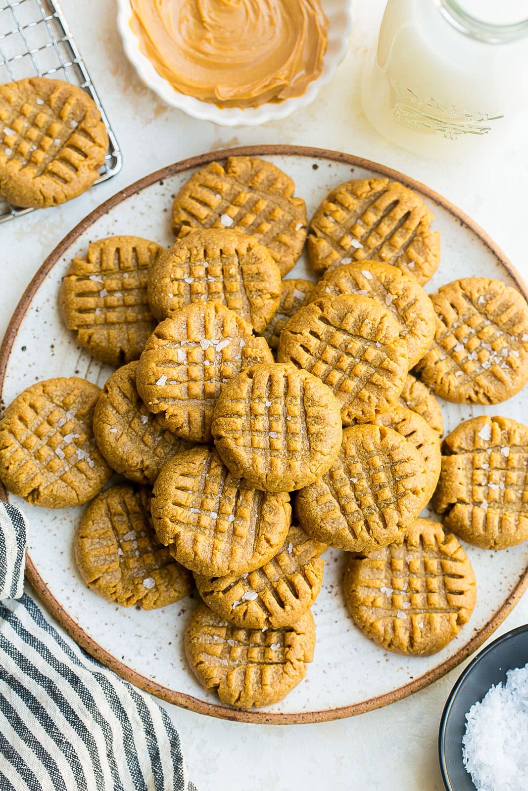 Gluten-free flourless peanut butter cookies on a white plate.