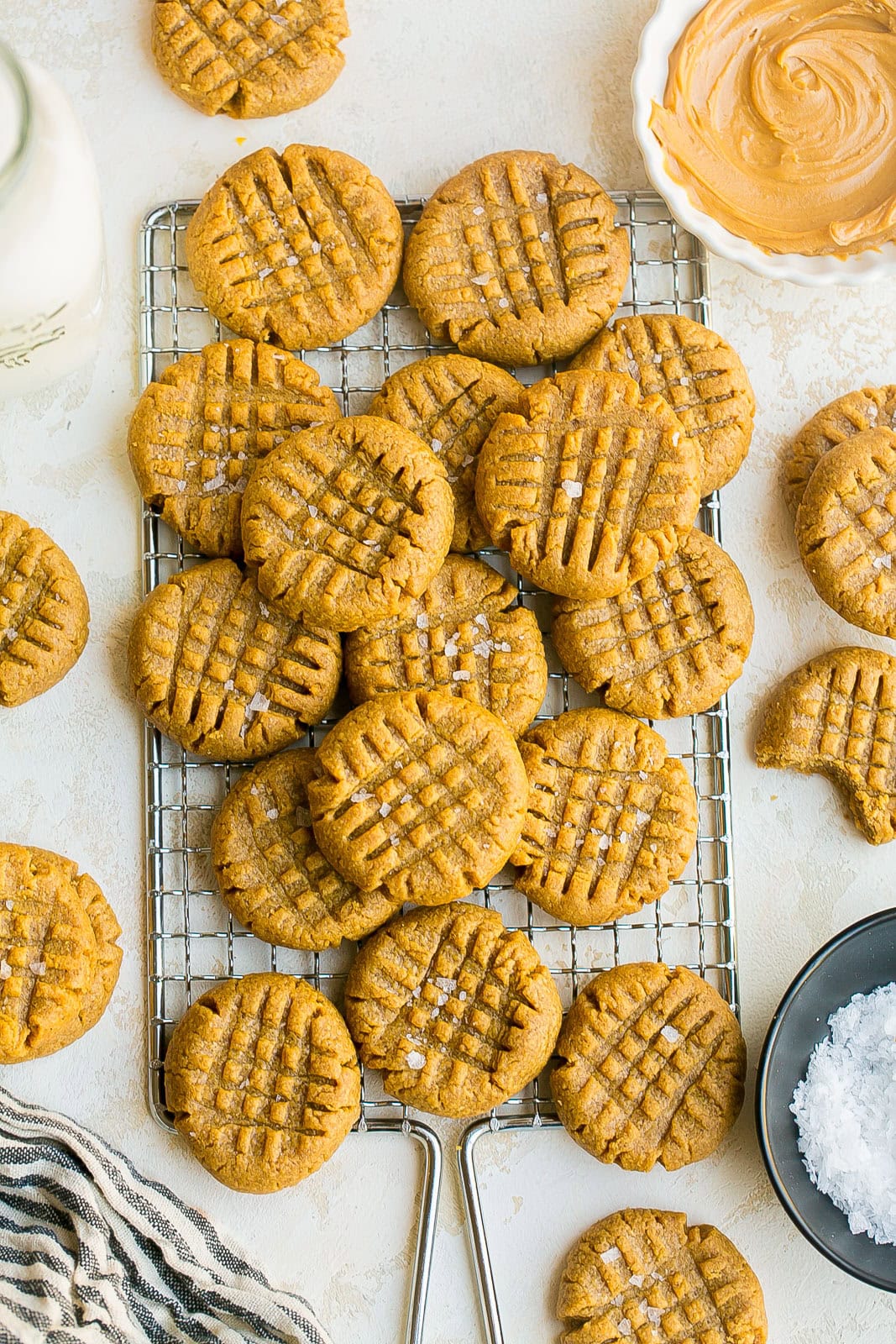 Homemade flourless peanut butter cookies fresh from the oven on a cooling rack.