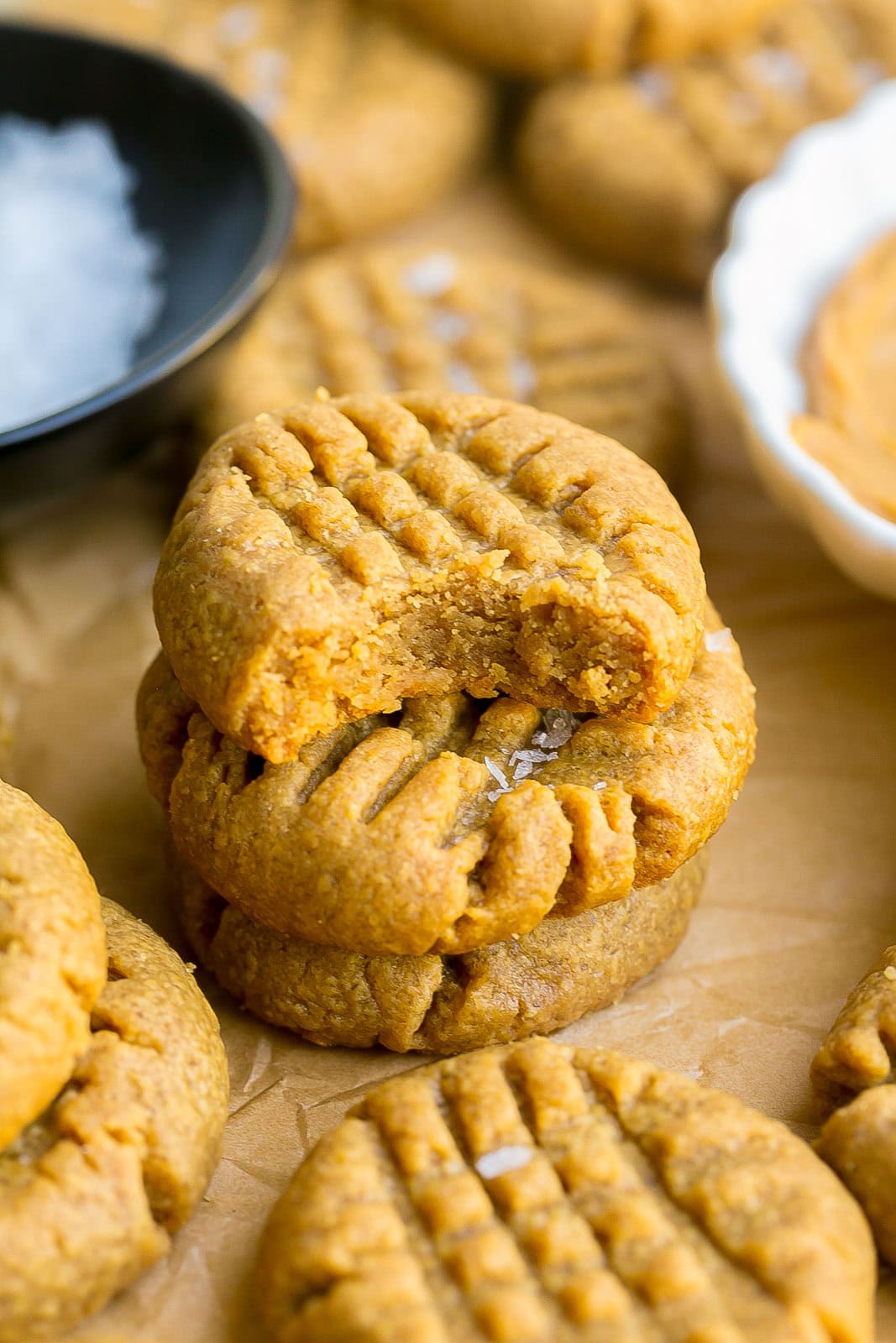 Flourless Peanut Butter Cookies Stack of flourless peanut butter cookies on a cooling rack.