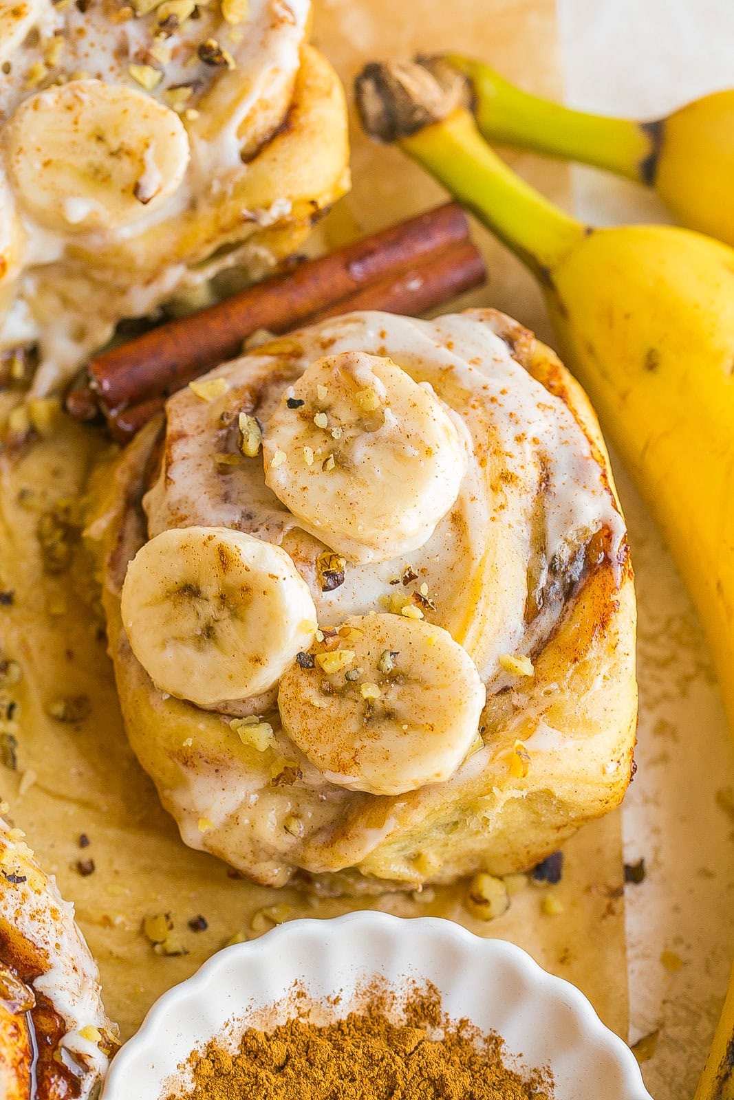 Homemade Banana Cinnamon Roll made with ripe bananas and topped with creamy cream cheese frosting.