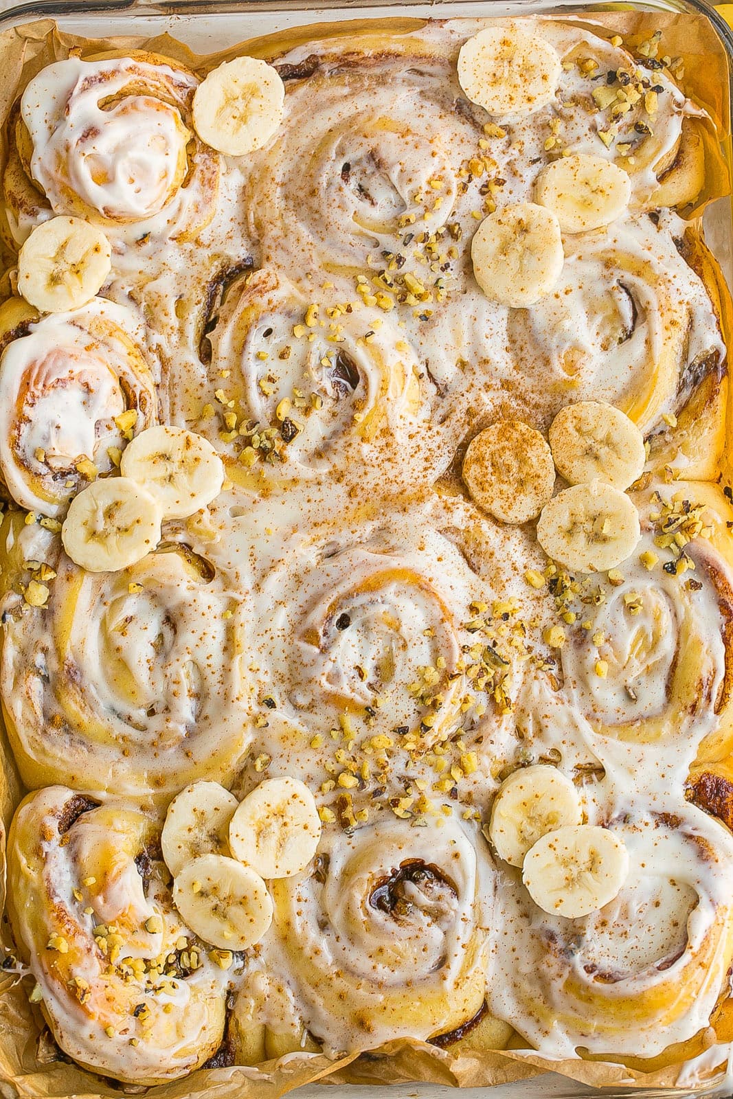 Fluffy homemade Banana Bread Cinnamon Rolls with swirls of cinnamon and rich cream cheese frosting.