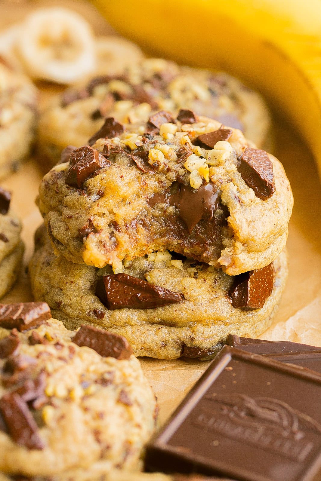 Stack of warm Banana Bread Chocolate Chip Cookies topped with chocolate chunks.