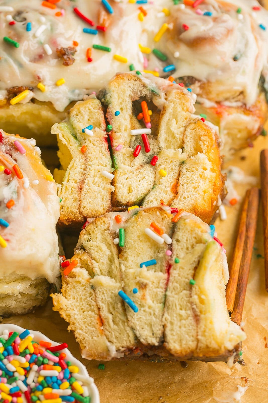 Festive cinnamon rolls with sprinkles served warm for breakfast or brunch.