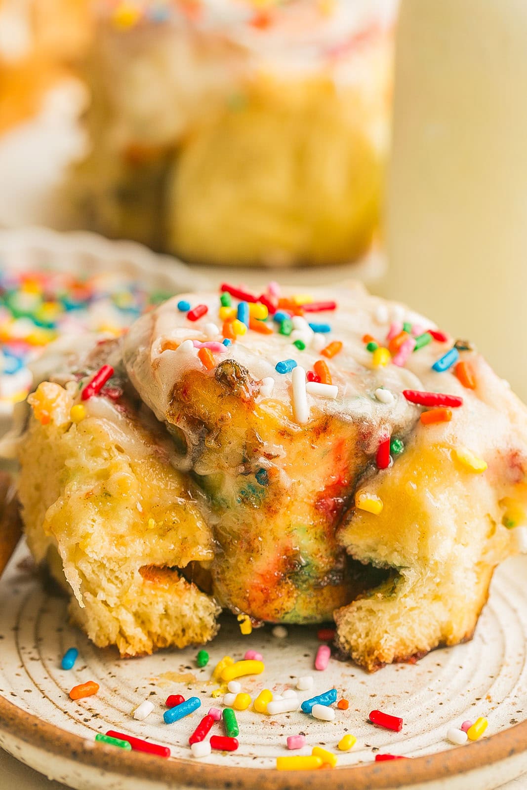 Bite from a funfetti cinnamon roll.