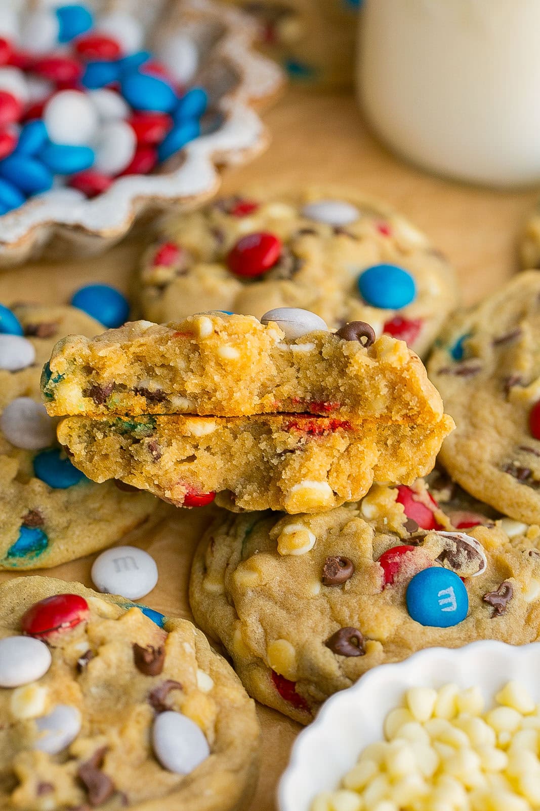 Gooey chocolate chip cookies with festive red white and blue M&M candies cut in half.
