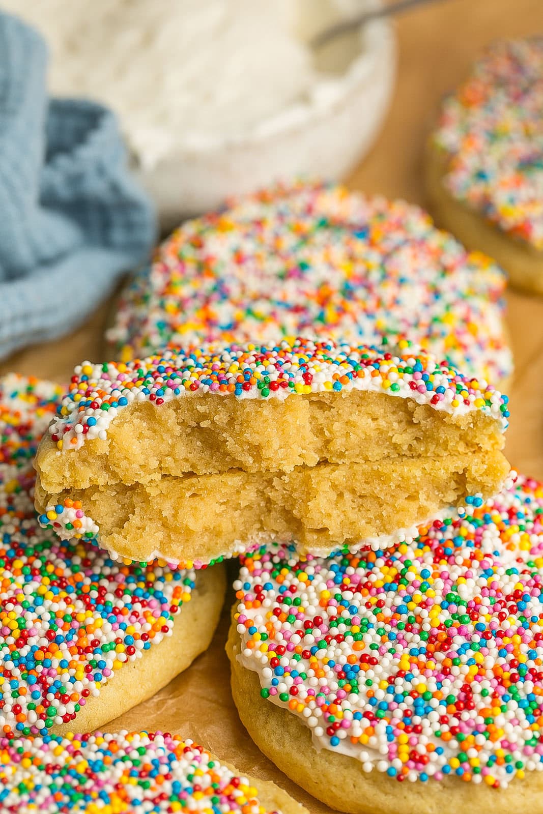 Inside of soft Dot Cookies with frosting and rainbow sprinkles.
