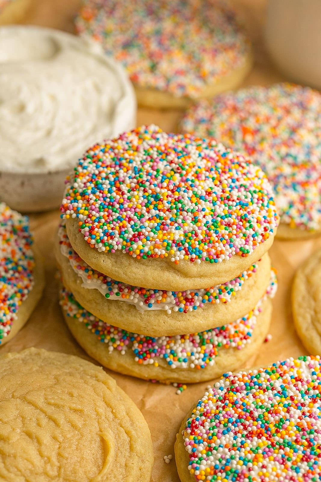 Close-up of a Frosted Sugar Cookie with Sprinkles showing its soft and chewy texture.