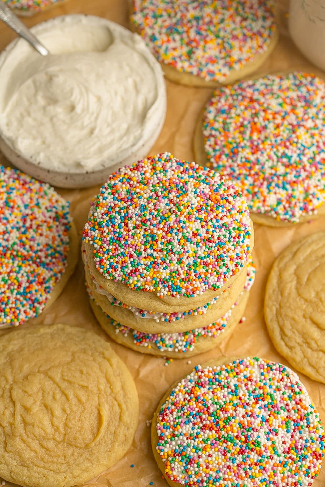Stack of thick sugar cookies topped with creamy frosting and colorful sprinkles inspired by the viral Dot Cake trend.