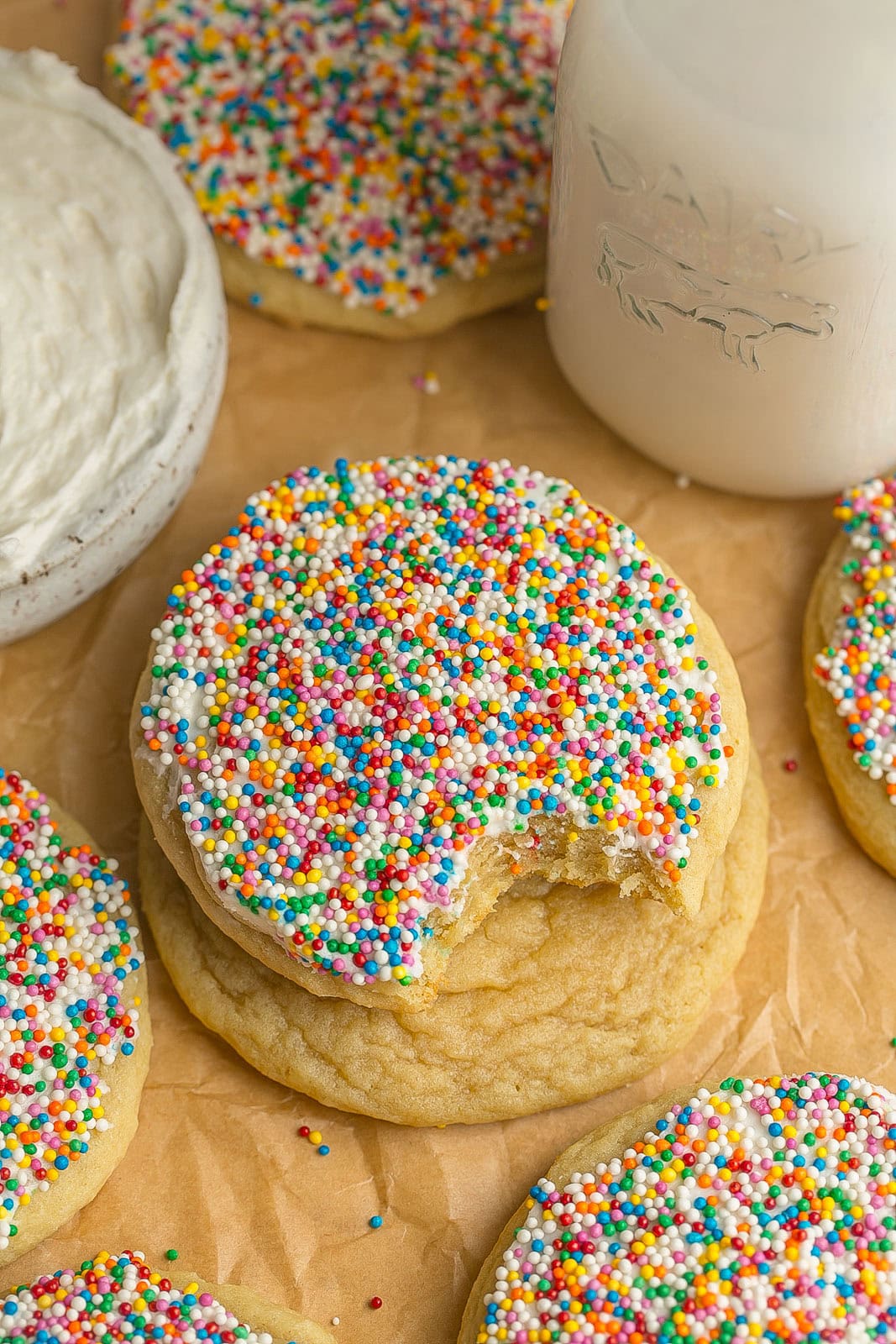 Colorful Frosted Sugar Cookies with Sprinkles made from scratch and decorated with rainbow sprinkles.