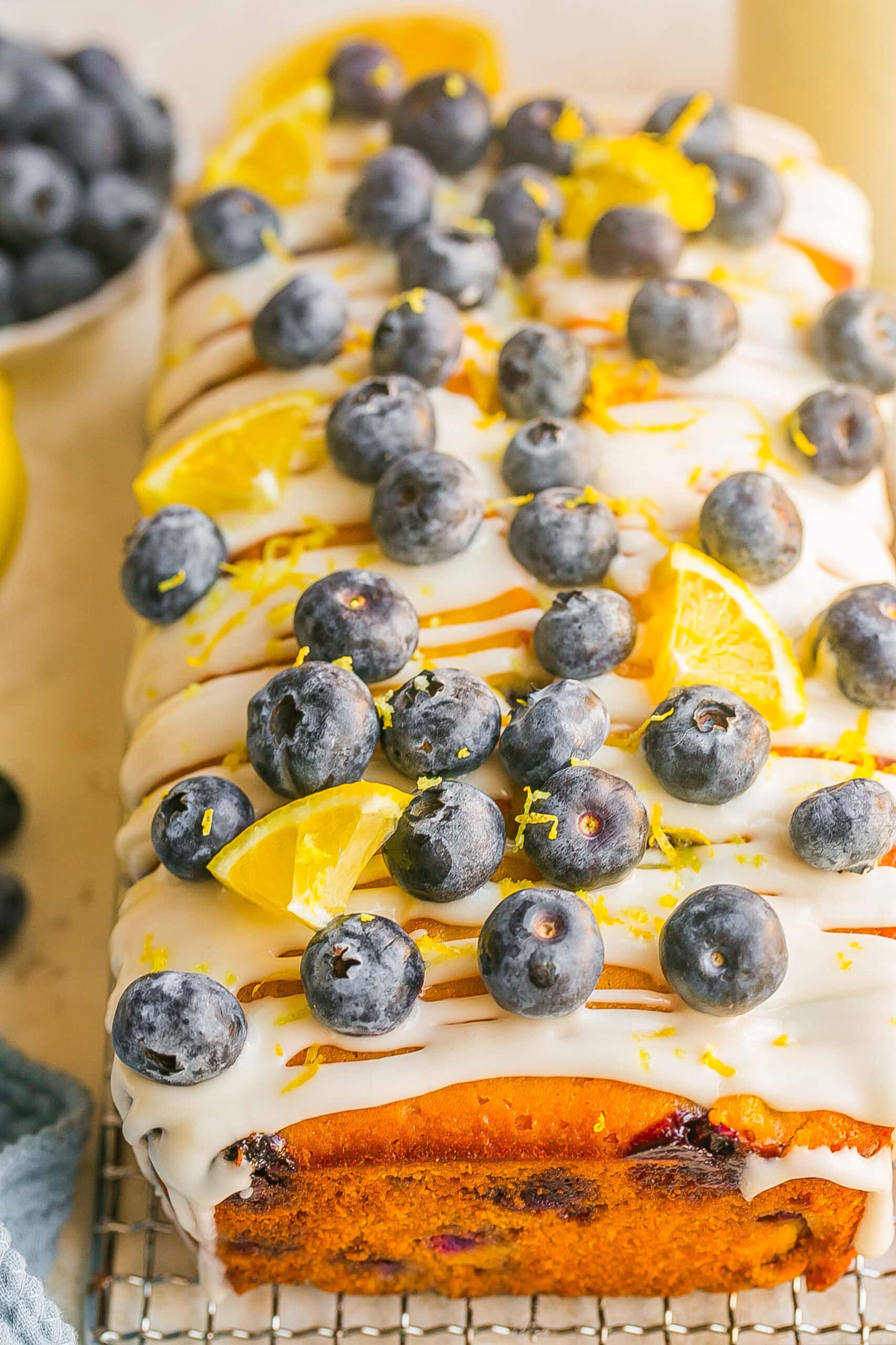Easy Blueberry Lemon Pound Cake made with fresh blueberries, lemon zest, and topped with a sweet lemon glaze.