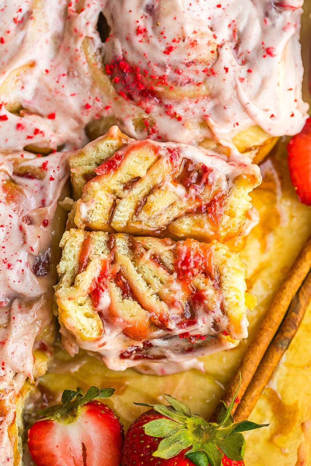 Close up of Strawberry Cinnamon Rolls with homemade strawberry filling.