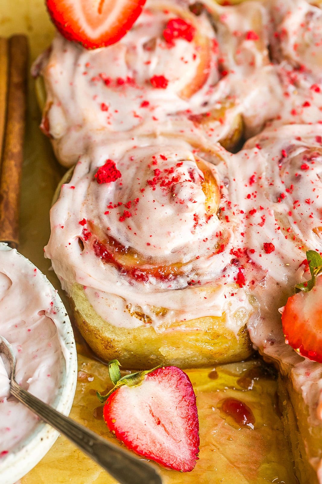 Freshly baked Strawberry Cinnamon Rolls with swirls of strawberry jam.