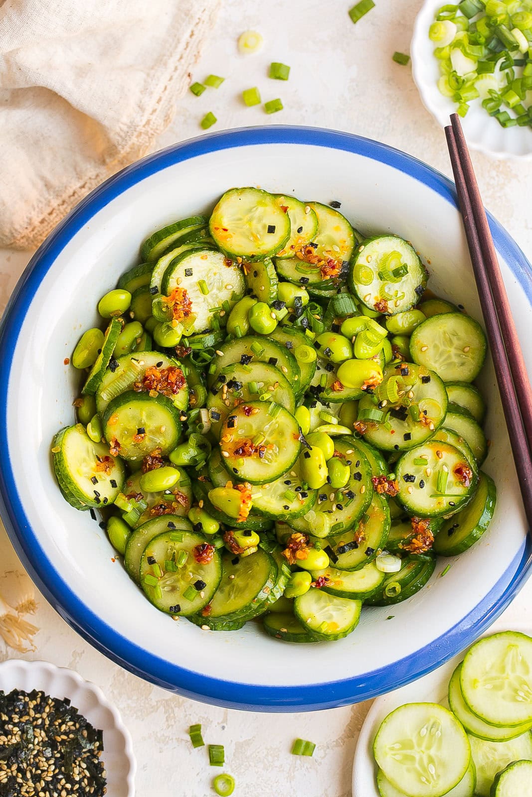 Refreshing Edamame and Cucumber Salad with cucumbers, edamame, sesame seeds, and a light sesame soy vinaigrette.