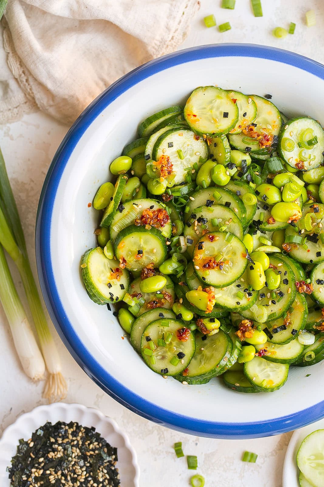 Refreshing Edamame and Cucumber Salad with cucumbers, edamame, sesame seeds, and a light sesame ginger soy dressing.