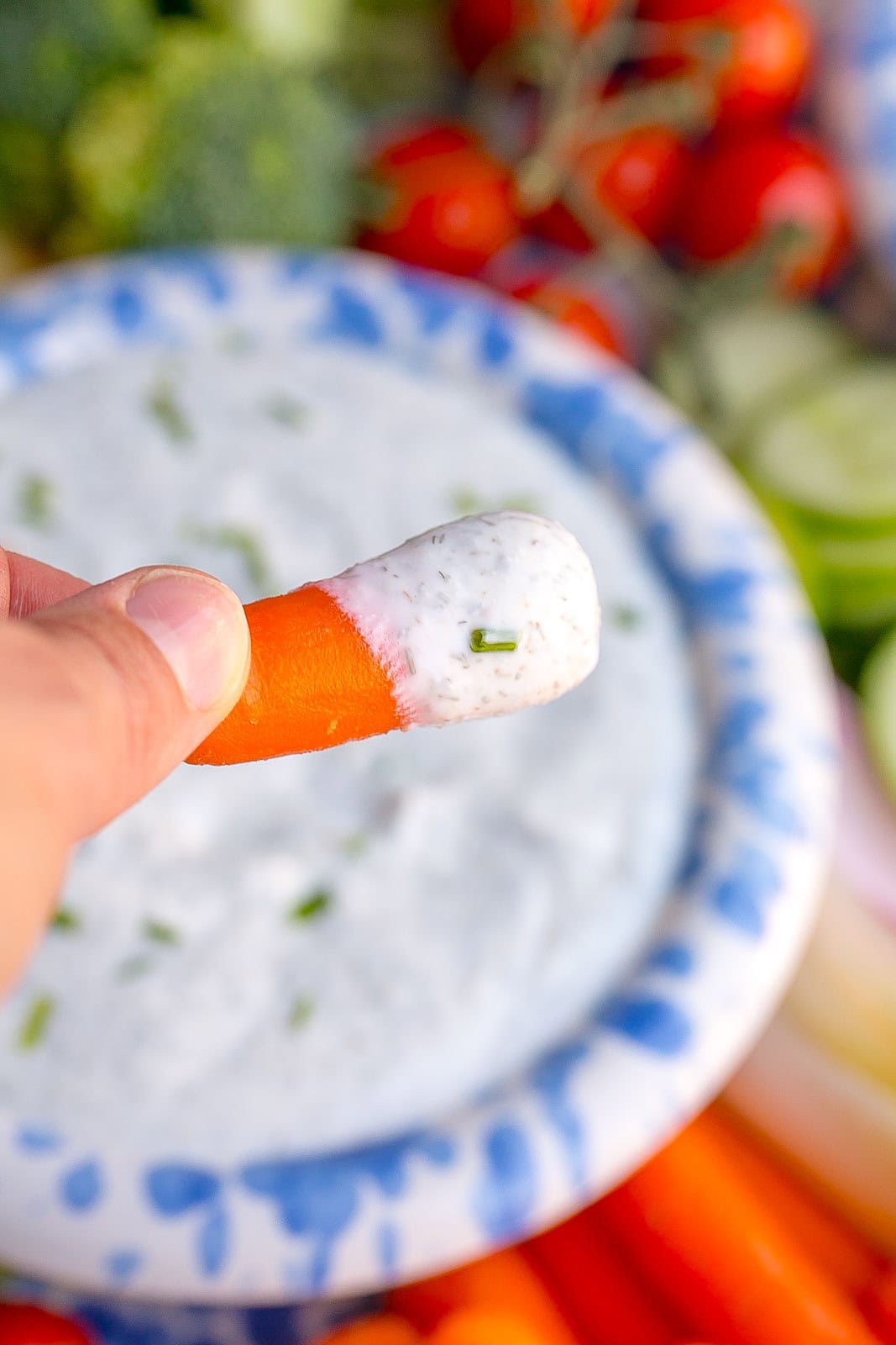 Carrot stick dipped in Greek Yogurt ranch dip recipe.